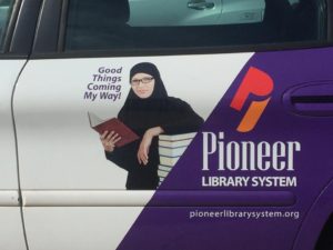 Muslim Woman Pioneer Library System Vehicle