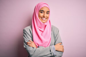 Young,Beautiful,Brunette,Businesswoman,Wearing,Pink,Muslim,Hijab,And,Business