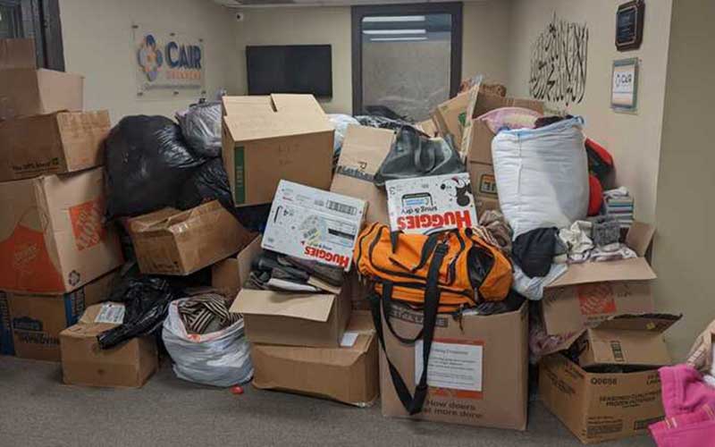 boxes of donations in tall stacks